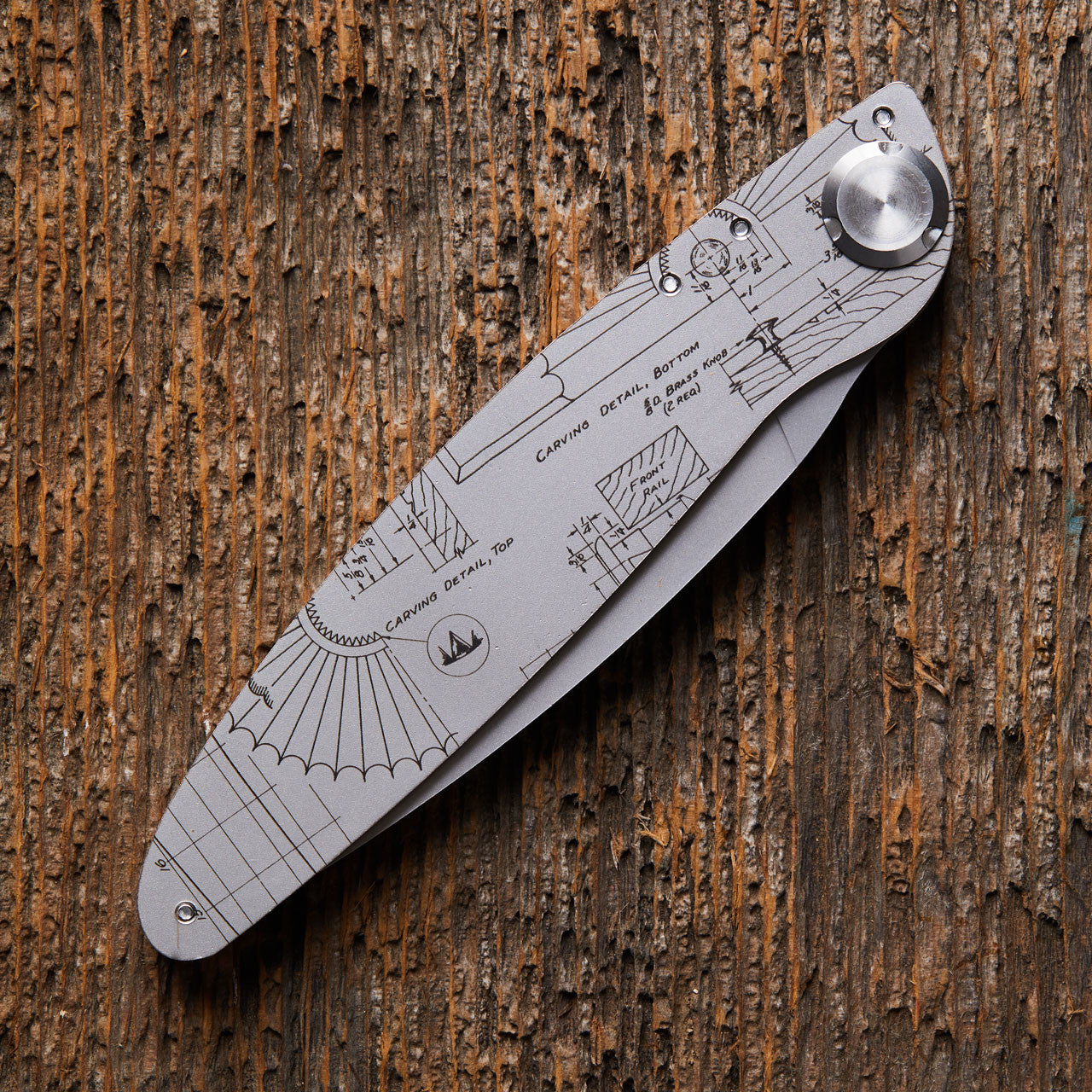 Folding Knife with engraved outdoor tool design closed