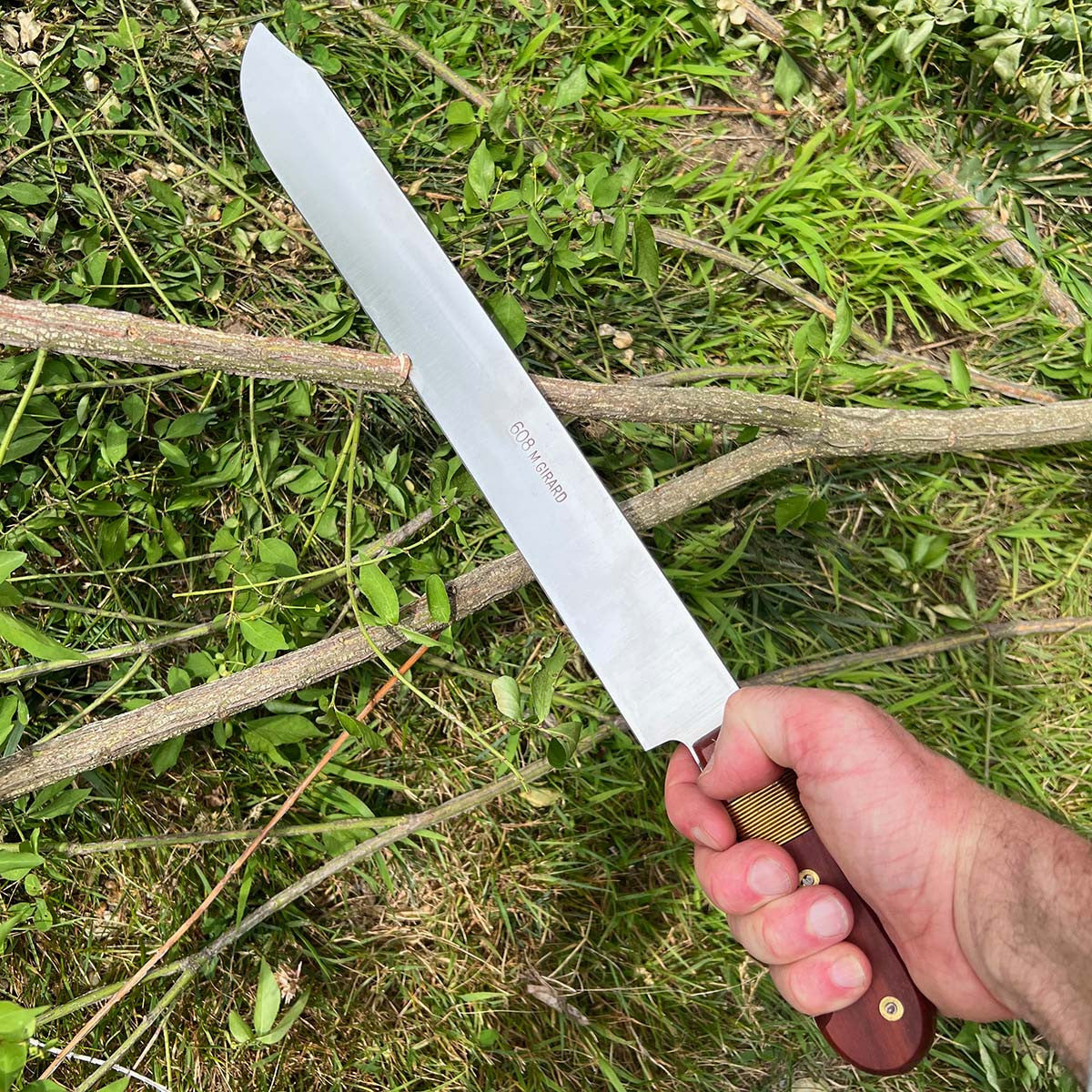 machete cutting branch