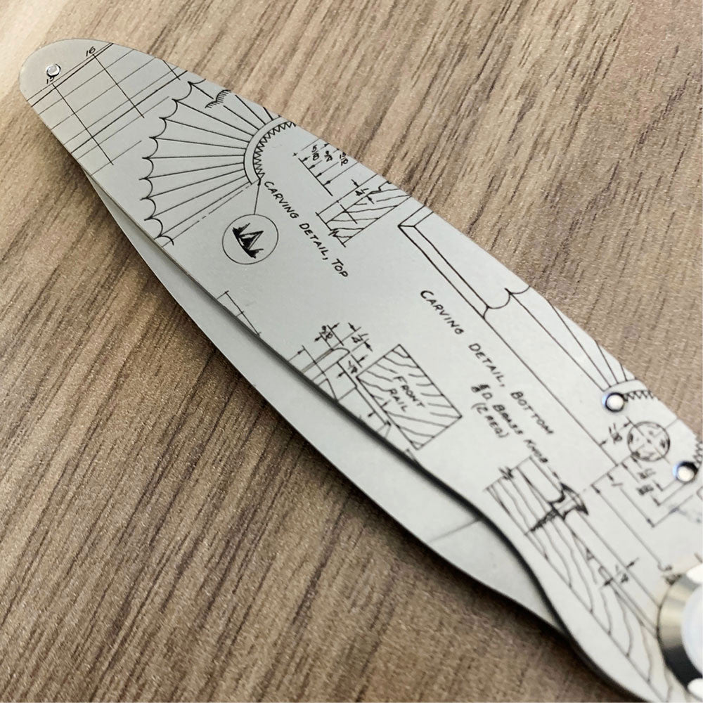 Folding Knife with engraved outdoor tool design closed