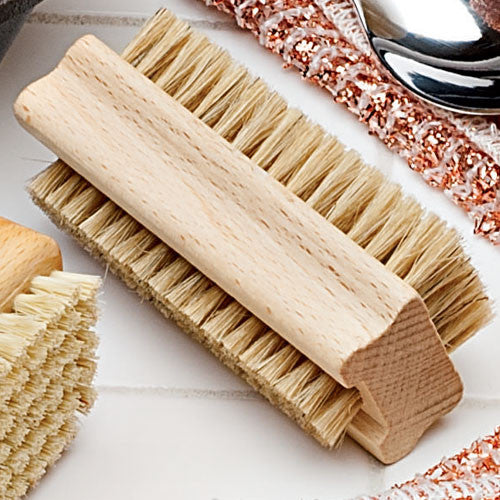 Nail brush for removing grime from fingers