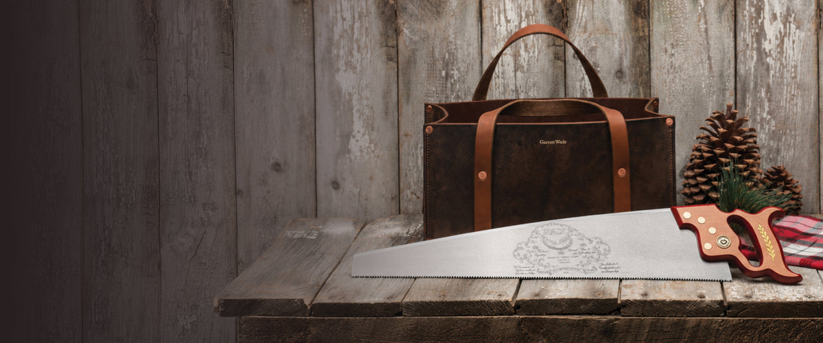 Pre-Holiday Sale: Garrett Wade leather tote and handsaw on a rustic wood table