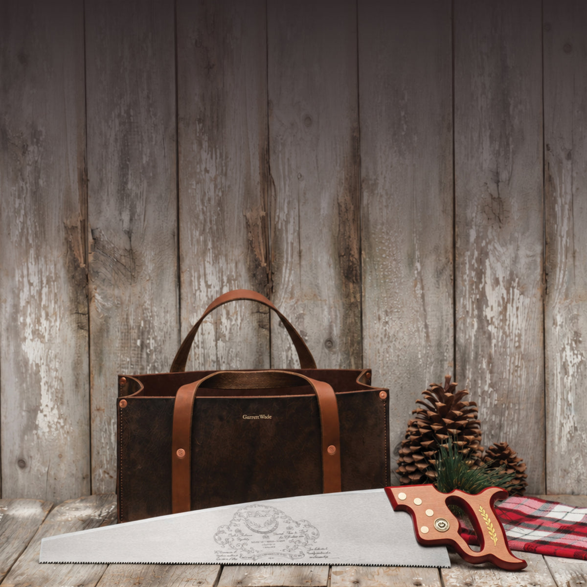 Pre-Holiday Sale: Garrett Wade leather tote and handsaw on a rustic wood table