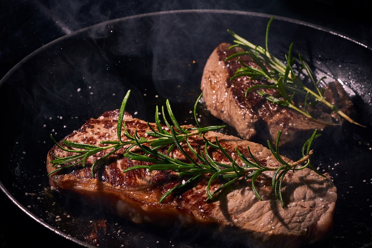 iron pan with beef and rosemary